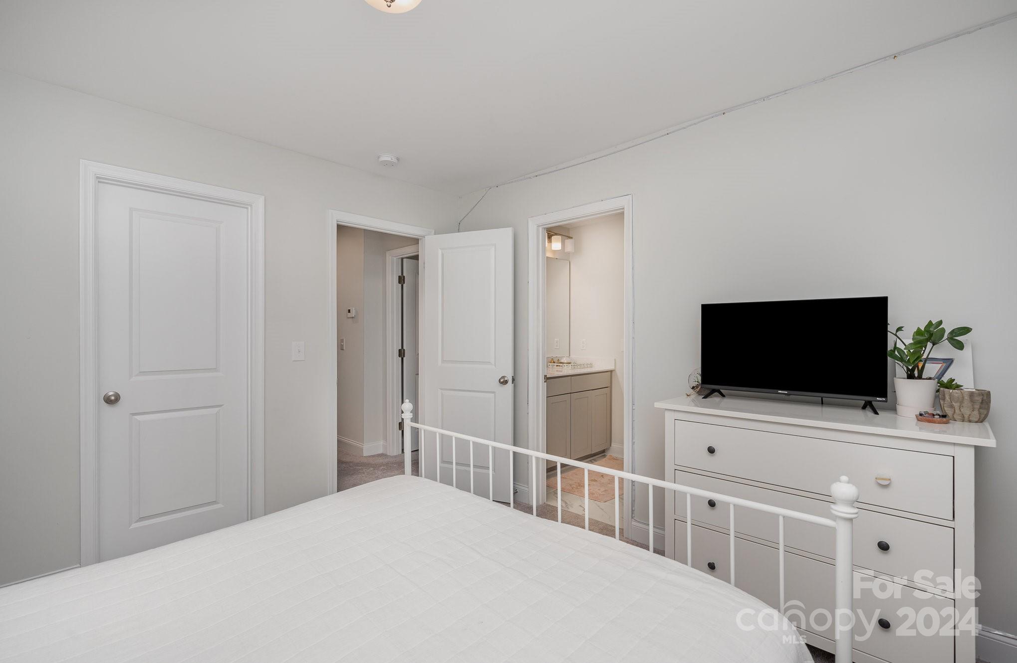 3063 Patchwork Court Fort Mill, SC 29708 - Photo 25 of 28 a bedroom with a bed and a flat screen tv