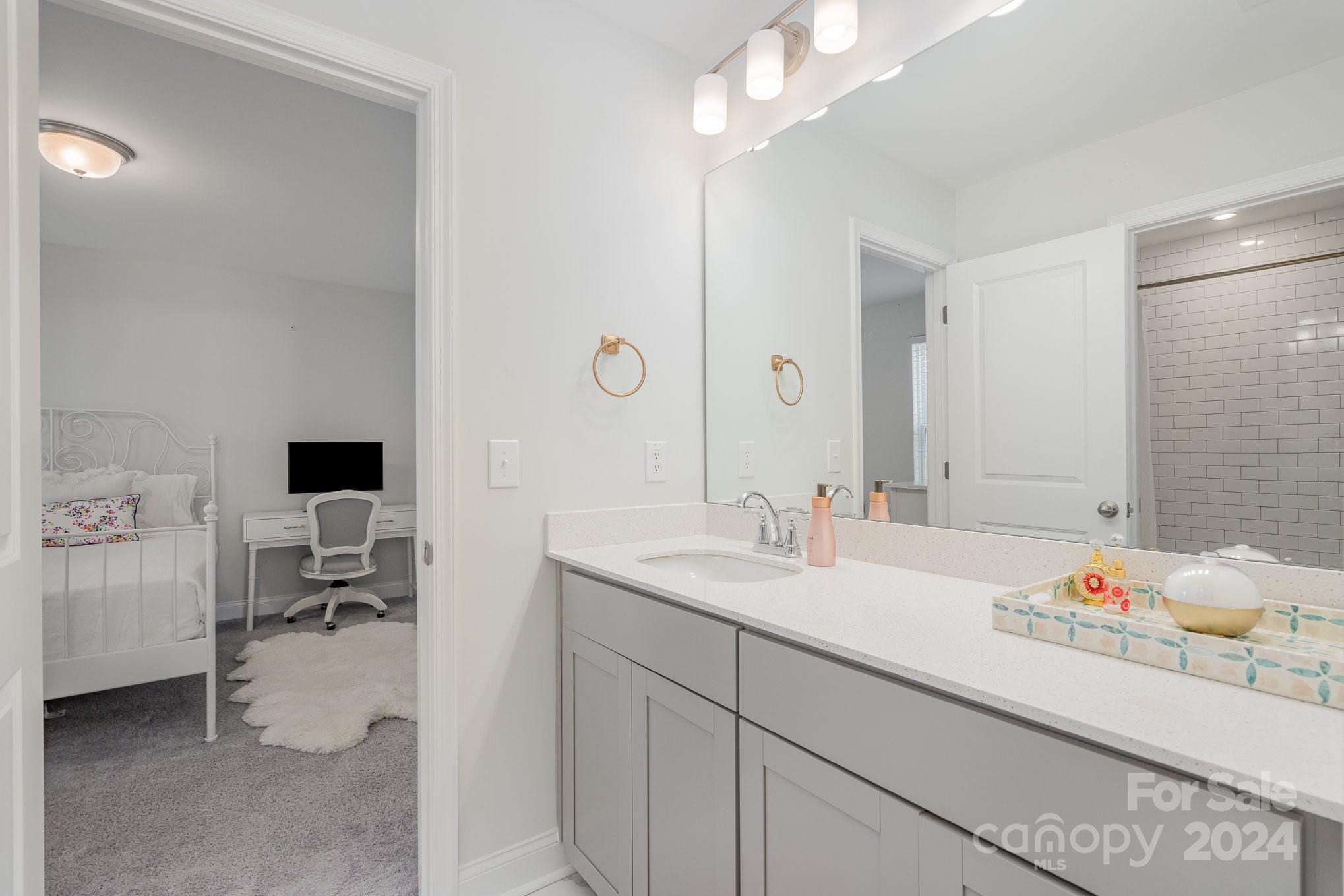 3063 Patchwork Court Fort Mill, SC 29708 - Photo 26 of 28 a en suite bathroom with a double vanity sink and a mirror