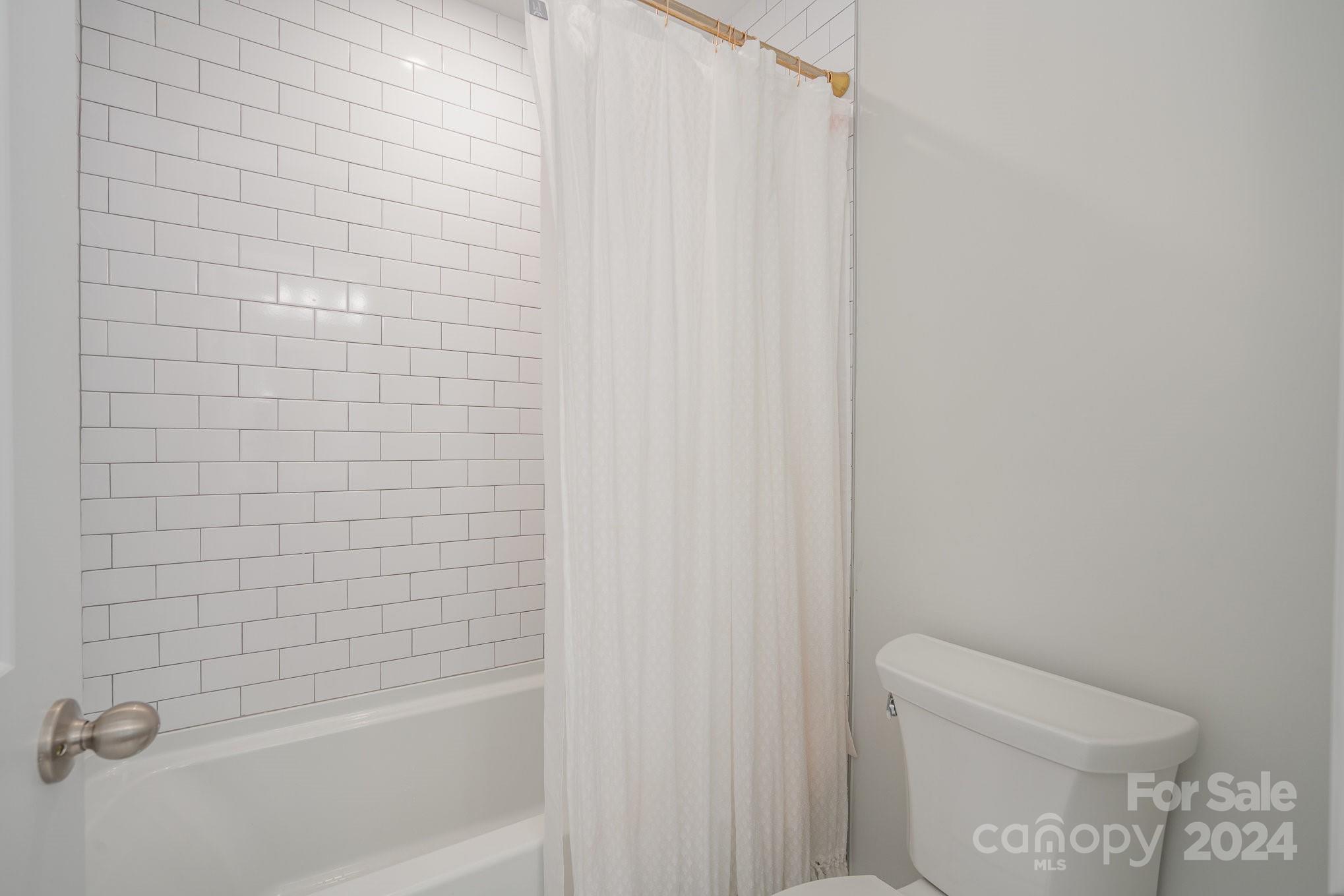3063 Patchwork Court Fort Mill, SC 29708 - Photo 27 of 28 a bathroom with a shower and a toilet