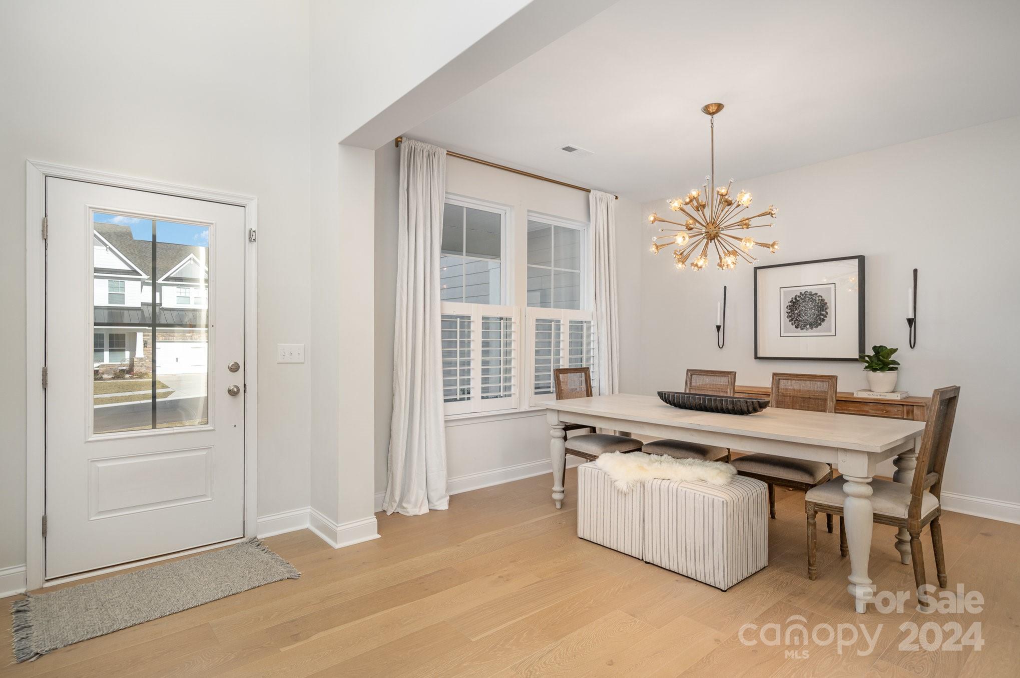 3063 Patchwork Court Fort Mill, SC 29708 - Photo 5 of 28 a view of a dining room with furniture and chandelier