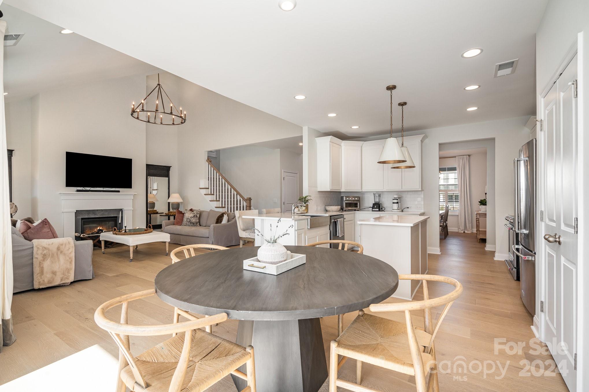 3063 Patchwork Court Fort Mill, SC 29708 - Photo 10 of 28 a kitchen with a dining table chairs and view kitchen