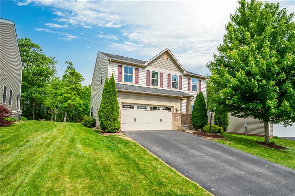 5018 Firwood Drive Canonsburg, PA 15317 - Photo 2 of 50 a front view of a house with a yard and garage