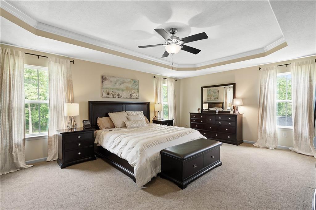 5018 Firwood Drive Canonsburg, PA 15317 - Photo 26 of 50 a spacious bedroom with a bed and a chandelier