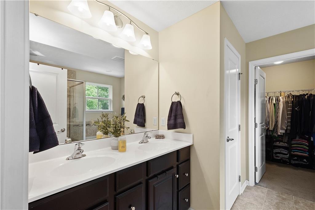 5018 Firwood Drive Canonsburg, PA 15317 - Photo 29 of 50 a bathroom with double vanity and a mirror