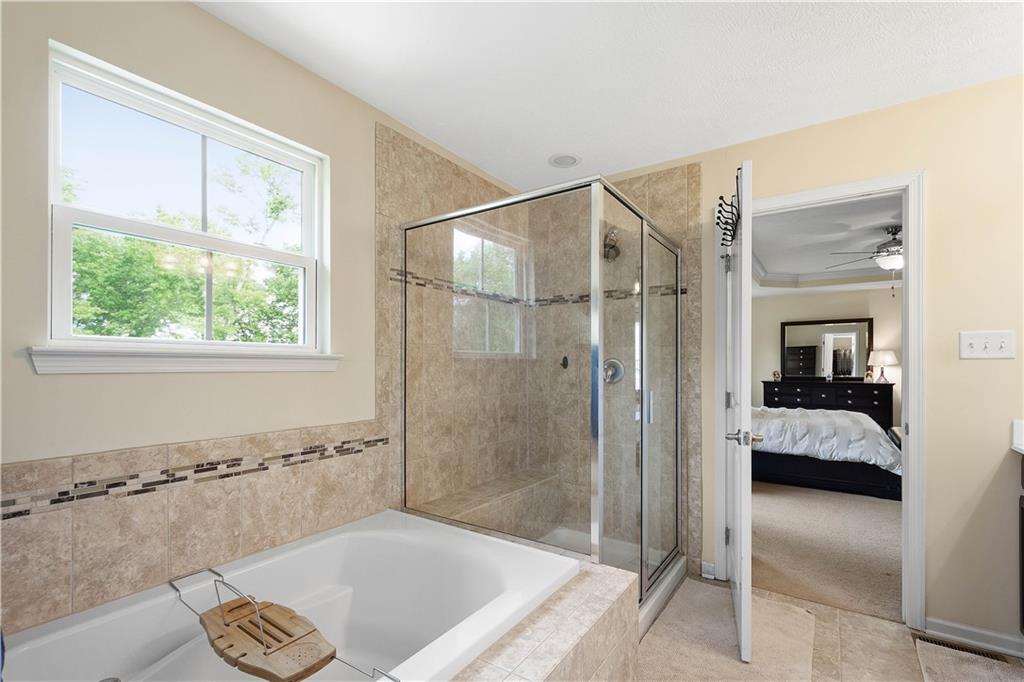 5018 Firwood Drive Canonsburg, PA 15317 - Photo 30 of 50 a bathroom with a tub and a shower