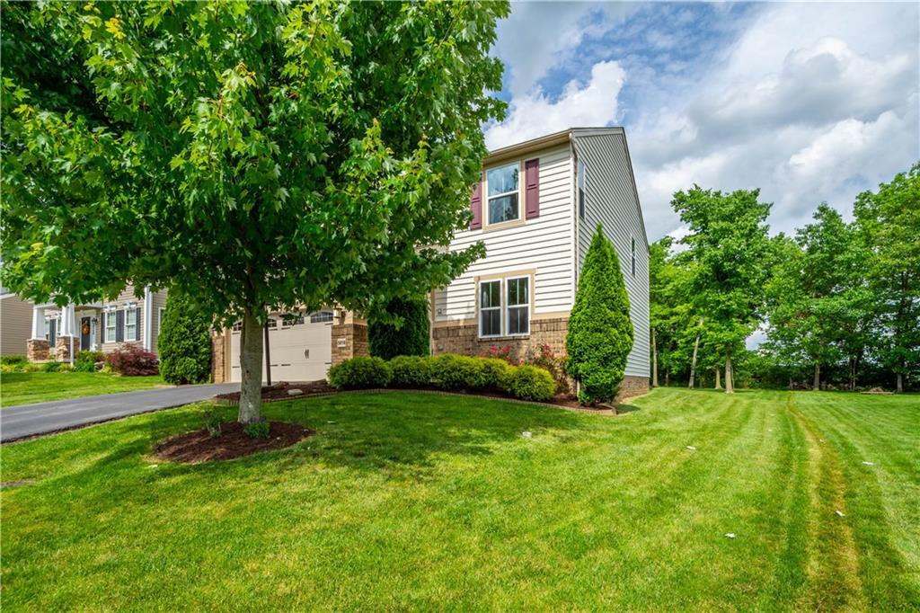 5018 Firwood Drive Canonsburg, PA 15317 - Photo 3 of 50 a front view of a house with a yard and trees