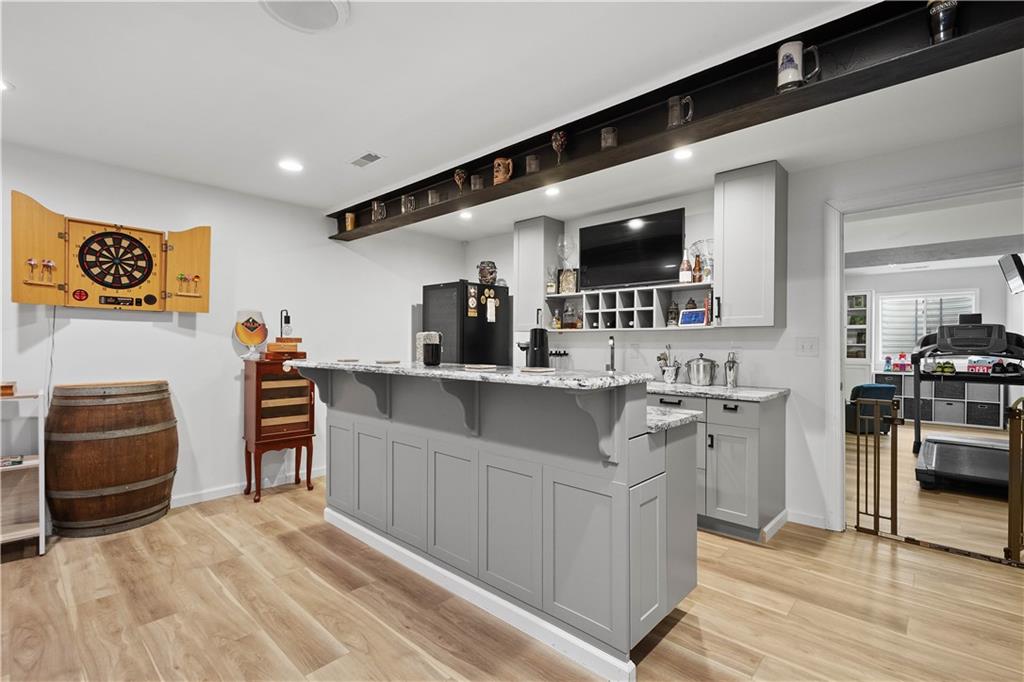 5018 Firwood Drive Canonsburg, PA 15317 - Photo 35 of 50 a kitchen with stainless steel appliances kitchen island granite countertop a sink and cabinets
