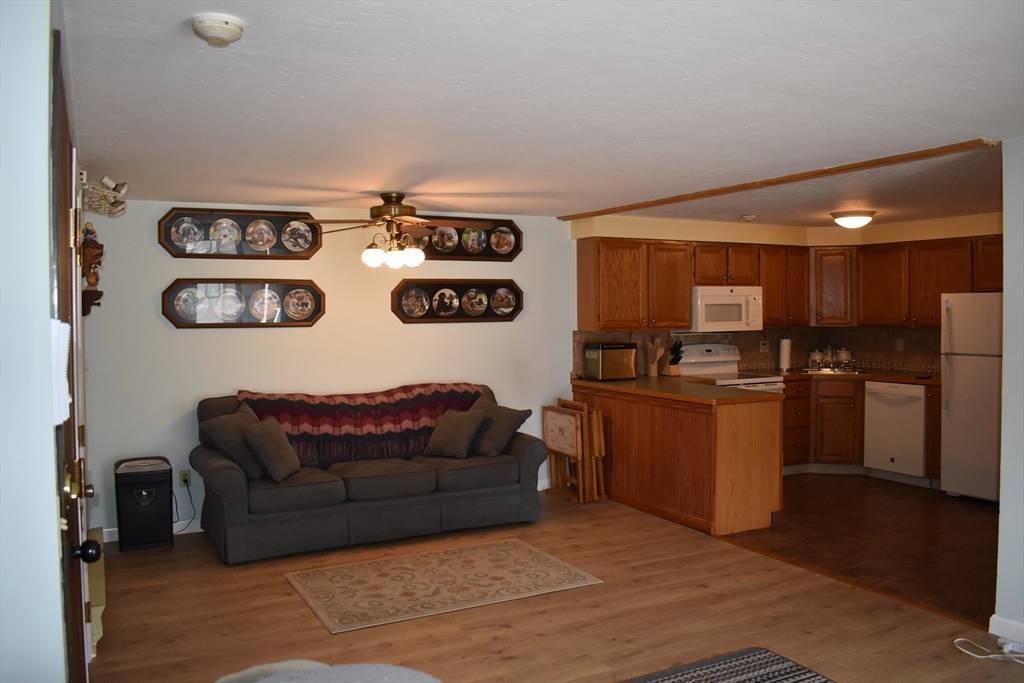 11 Hulbert Road, Unit 1 Worcester, MA 01603 - Photo 2 of 7 a living room with furniture and kitchen view