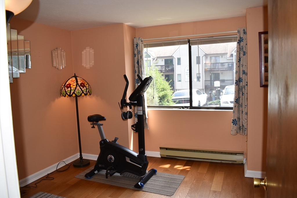 11 Hulbert Road, Unit 1 Worcester, MA 01603 - Photo 3 of 7 a room with gym equipment and a large window