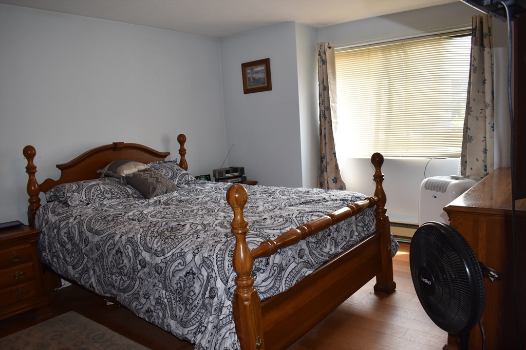11 Hulbert Road, Unit 1 Worcester, MA 01603 - Photo 6 of 7 a bedroom with a bed and window
