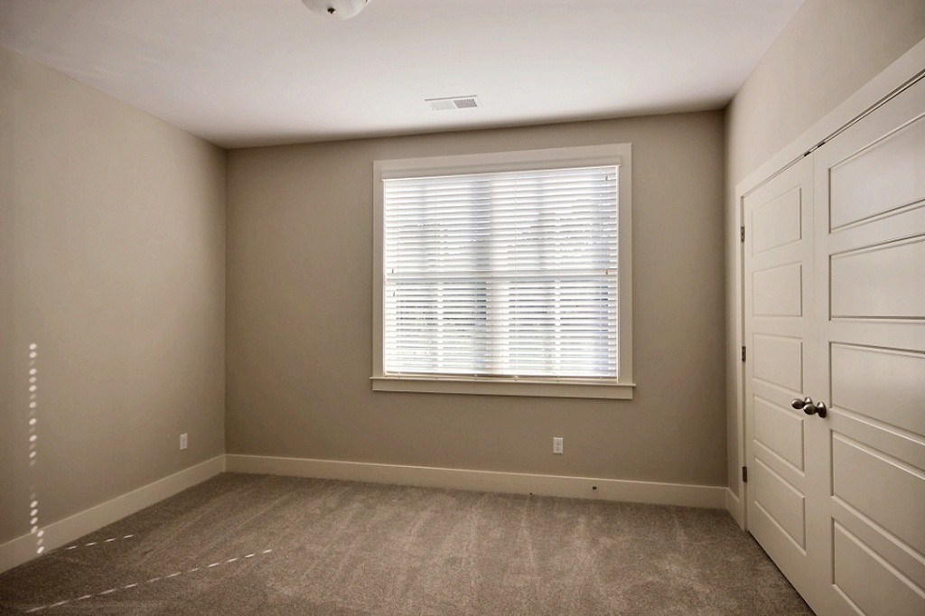 186 East South Street, Unit 1 Collierville, TN 38017 - Photo 16 of 22 an empty room with a window