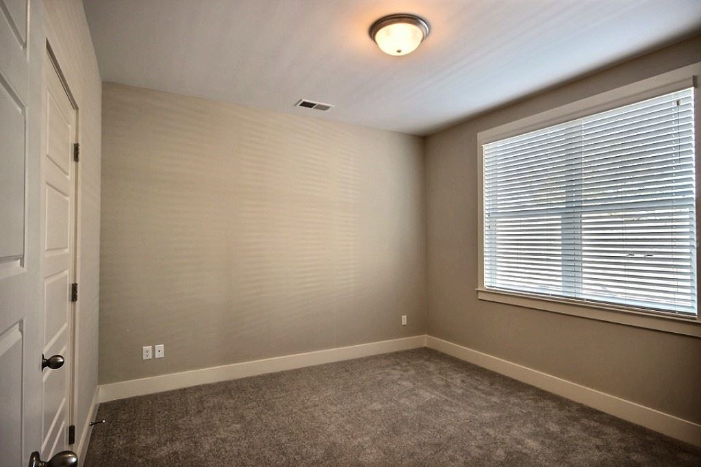 186 East South Street, Unit 1 Collierville, TN 38017 - Photo 18 of 22 an empty room with a window