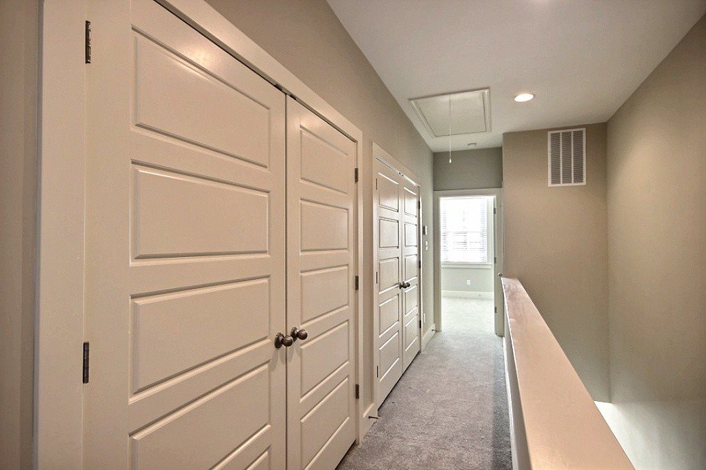186 East South Street, Unit 1 Collierville, TN 38017 - Photo 19 of 22 a view of hallway with closet and chandelier