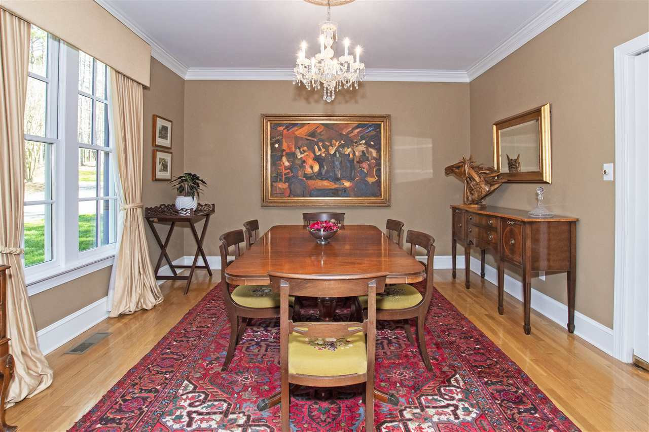 5817 Laurel Rock Lane Raleigh, NC 27613 - Photo 10 of 30 Formal dining room off the kitchen is large and open to the foyer to welcome your guests for gatherings! Dining Room