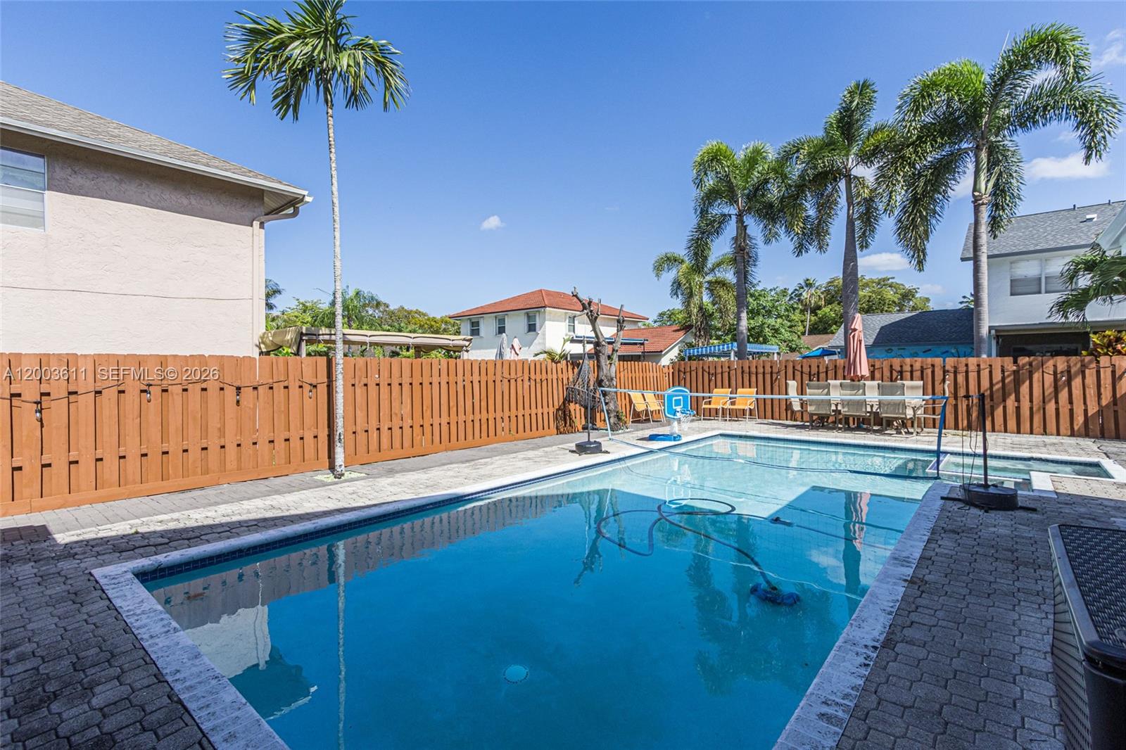 7941 Northwest 3rd Place Plantation, FL 33324 - Photo 14 of 51 a view of a swimming pool with a lounge chair