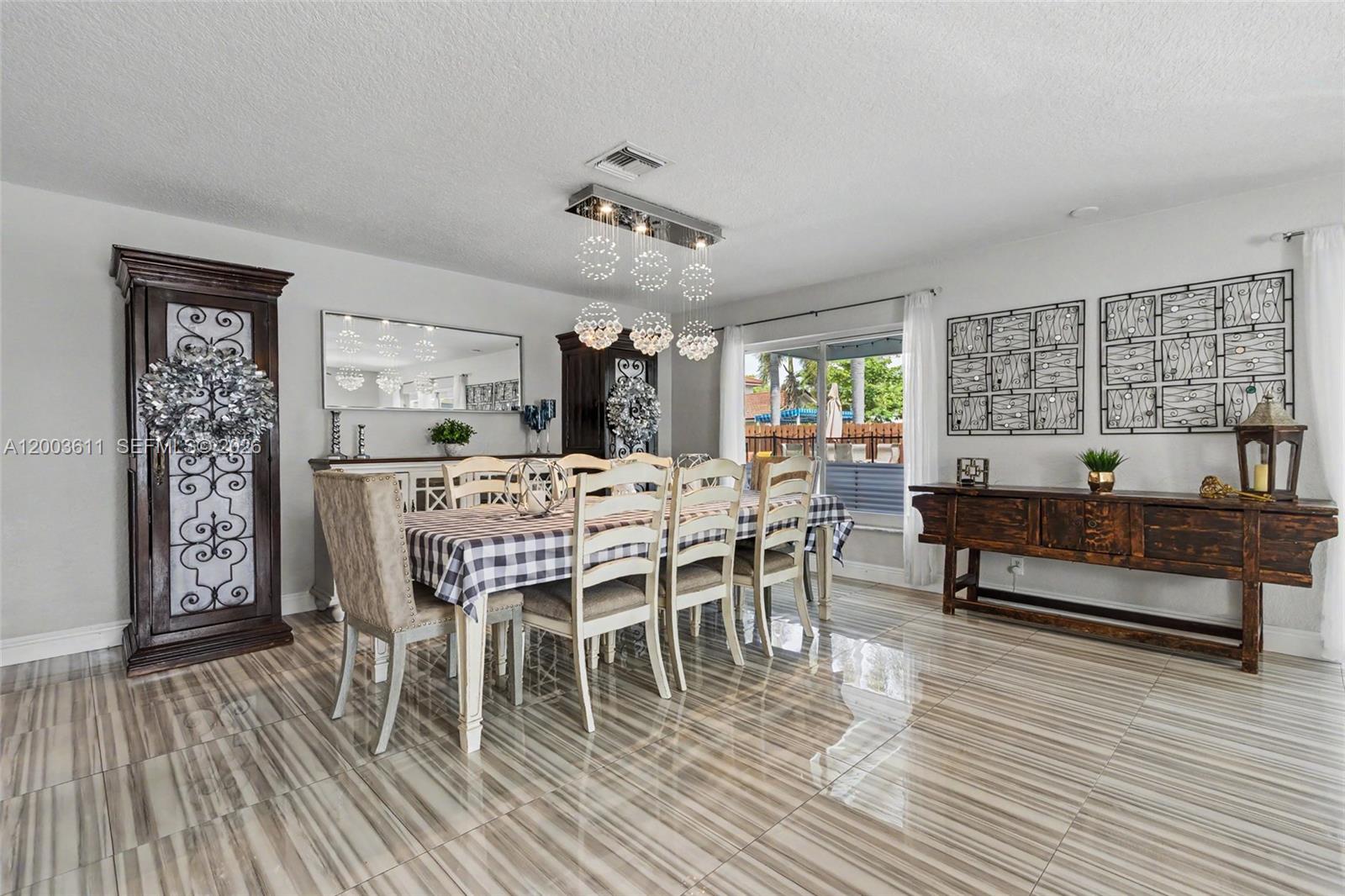 7941 Northwest 3rd Place Plantation, FL 33324 - Photo 28 of 51 a view of a dining room with furniture window and wooden floor
