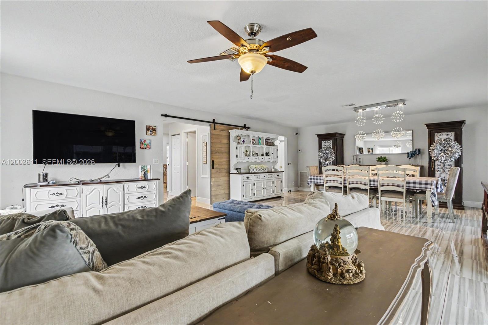 7941 Northwest 3rd Place Plantation, FL 33324 - Photo 31 of 51 a living room with furniture and a flat screen tv
