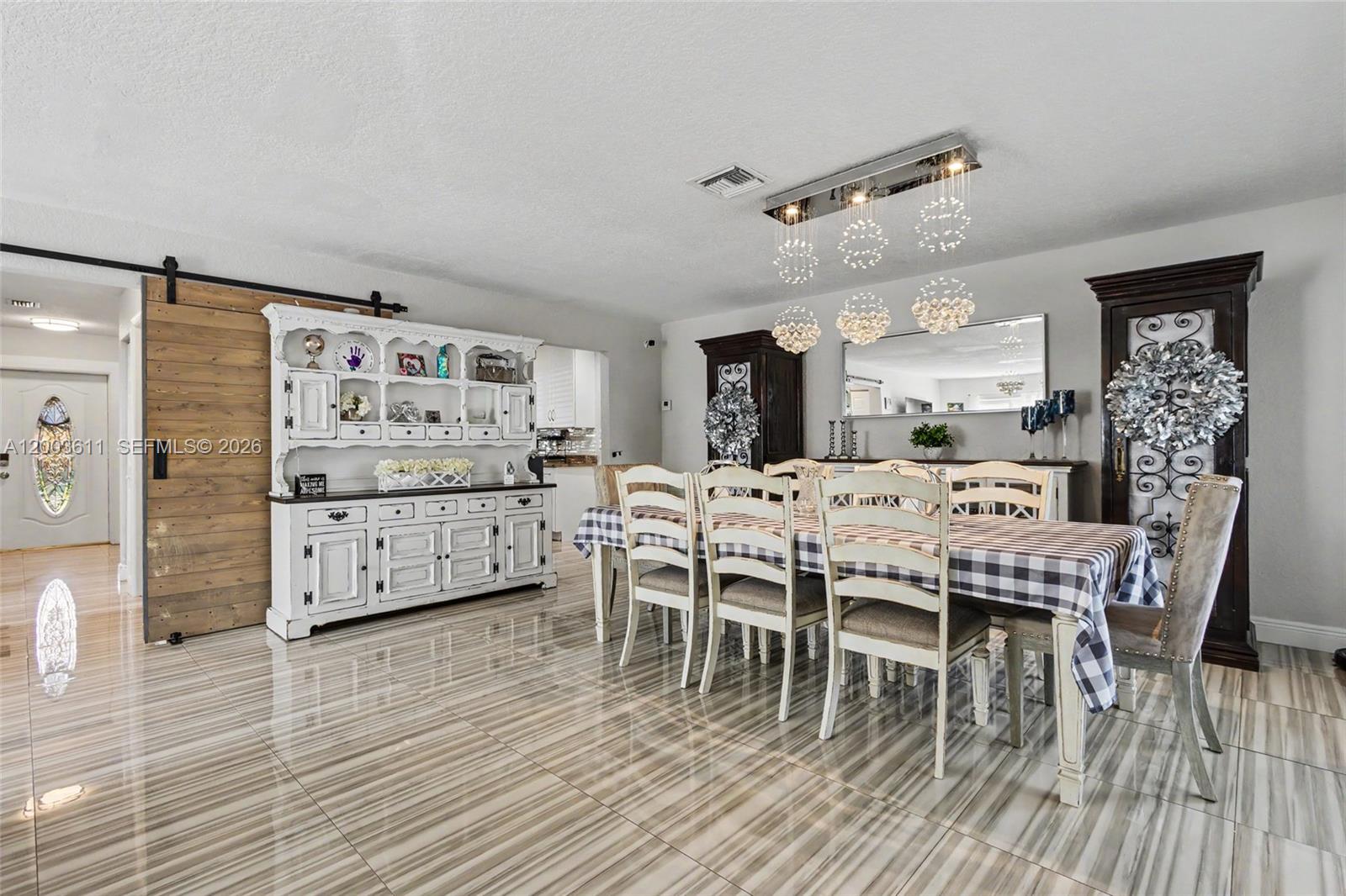 7941 Northwest 3rd Place Plantation, FL 33324 - Photo 33 of 51 a dining room with furniture and wooden floor