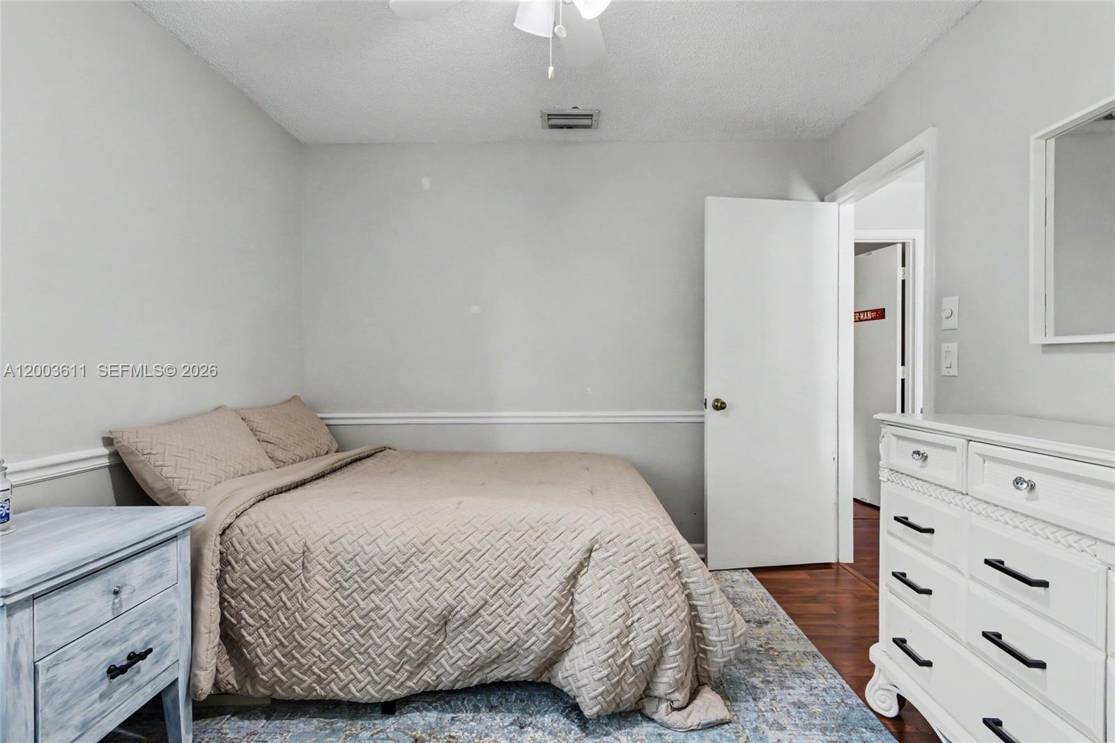 7941 Northwest 3rd Place Plantation, FL 33324 - Photo 39 of 51 a bedroom with a bed and a dresser