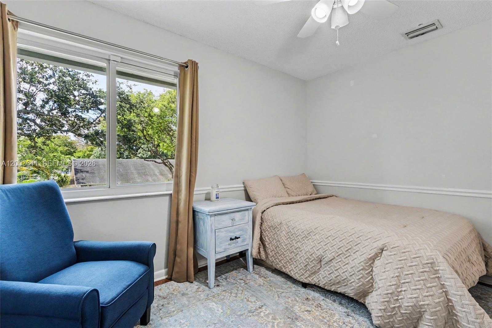 7941 Northwest 3rd Place Plantation, FL 33324 - Photo 40 of 51 a bedroom with a bed and a couch