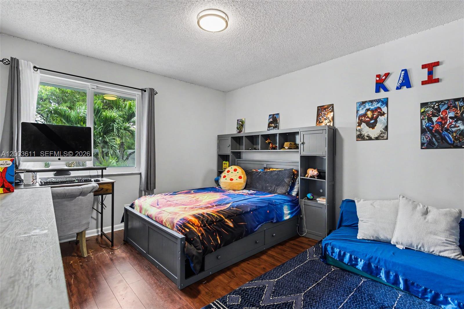 7941 Northwest 3rd Place Plantation, FL 33324 - Photo 41 of 51 a bedroom with a bed and a flat screen tv
