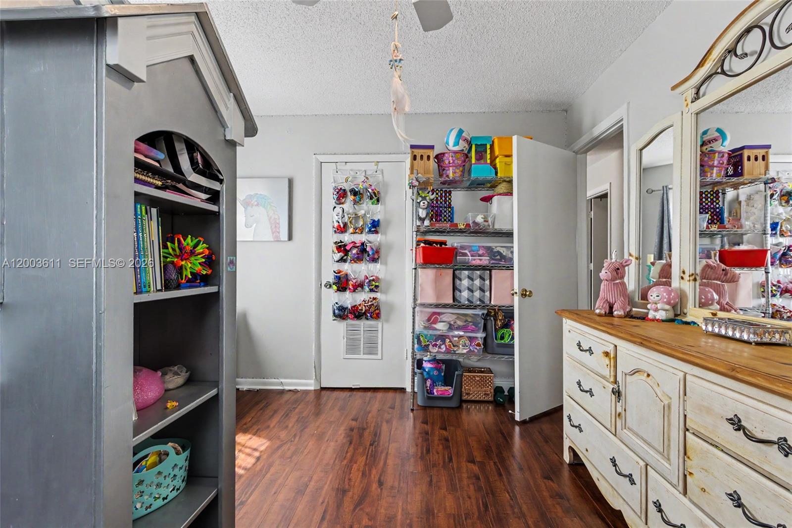 7941 Northwest 3rd Place Plantation, FL 33324 - Photo 45 of 51 a view of a play room with toys and wooden floor
