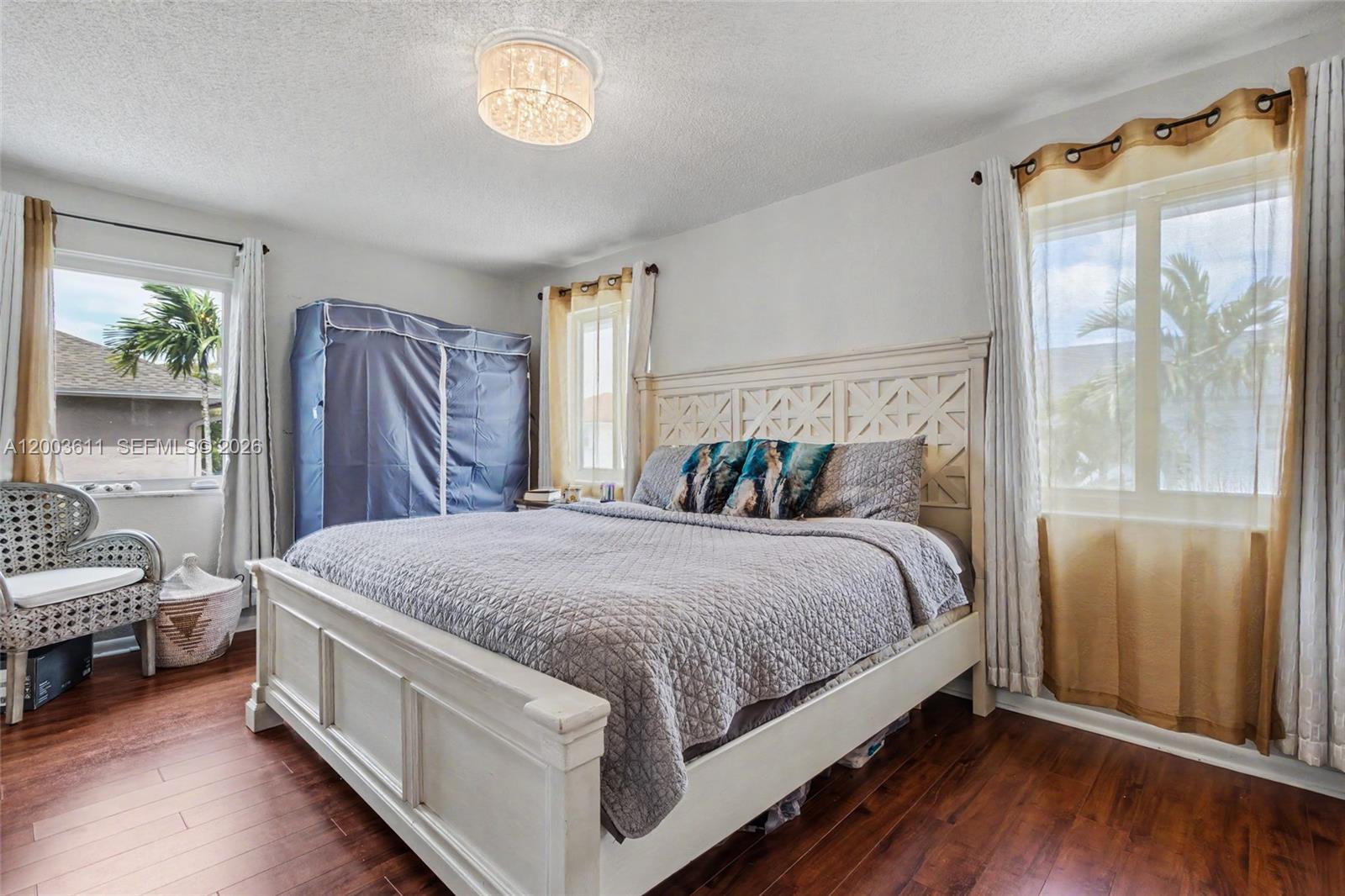 7941 Northwest 3rd Place Plantation, FL 33324 - Photo 46 of 51 a spacious bedroom with a bed and a window