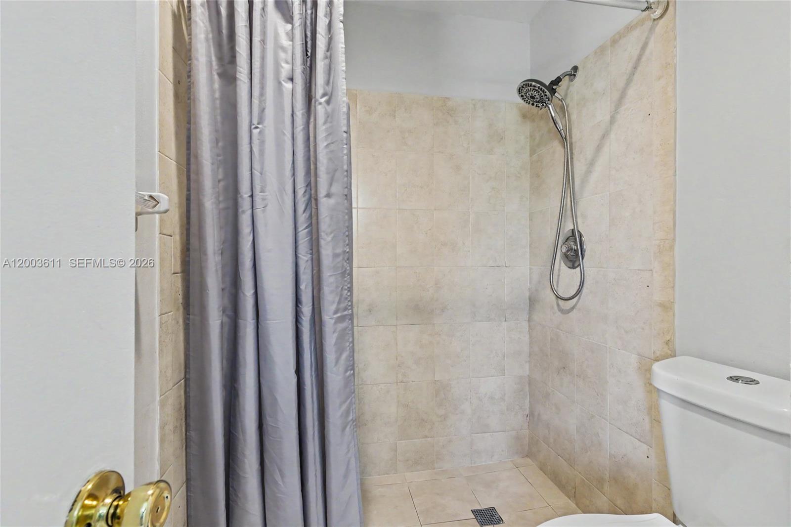 7941 Northwest 3rd Place Plantation, FL 33324 - Photo 49 of 51 a bathroom with a shower and a toilet