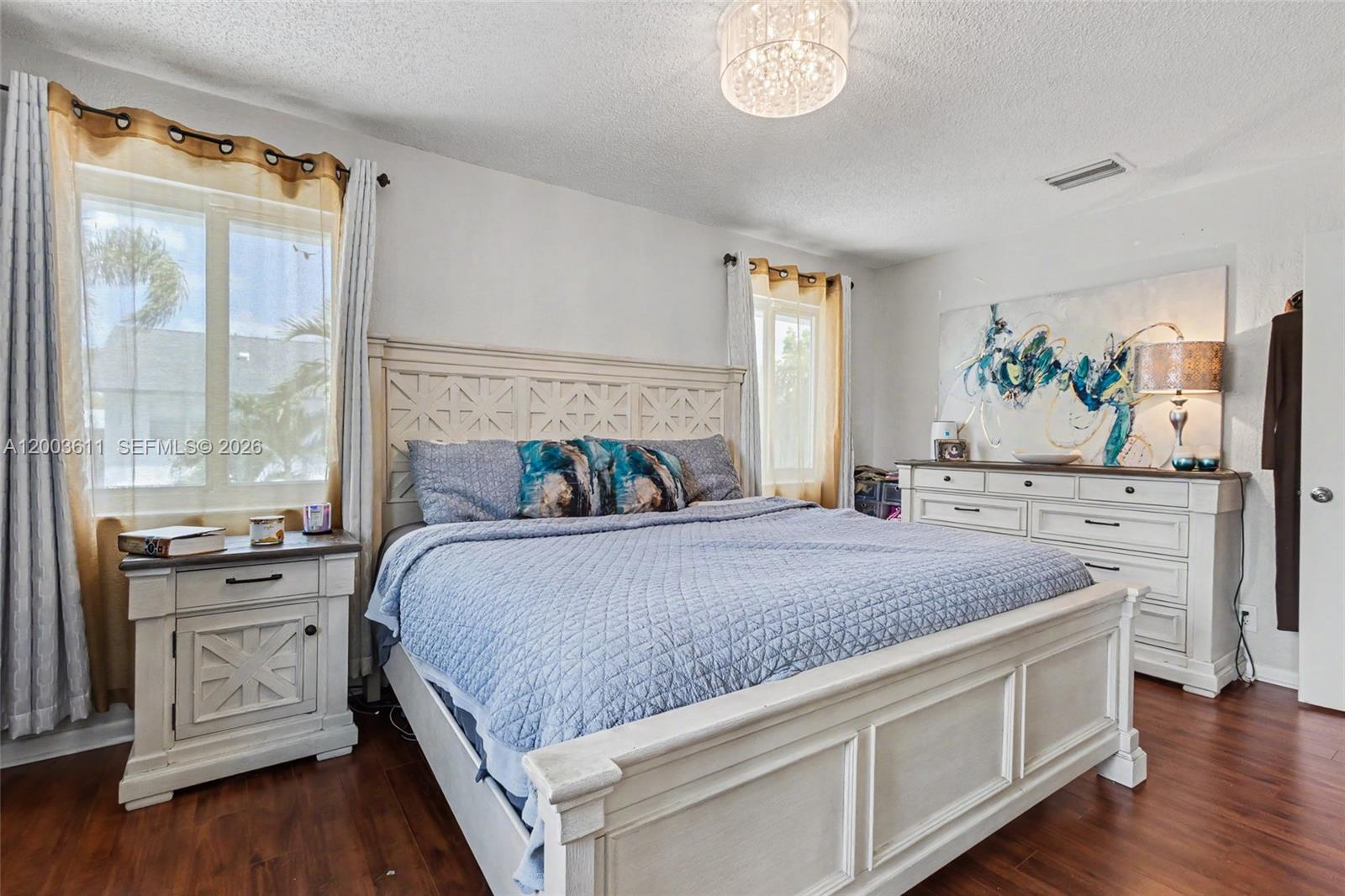 7941 Northwest 3rd Place Plantation, FL 33324 - Photo 50 of 51 a bedroom with a bed and a large window