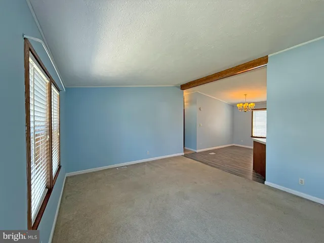 a view of an empty room and window