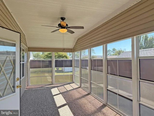 a view of empty room with windows