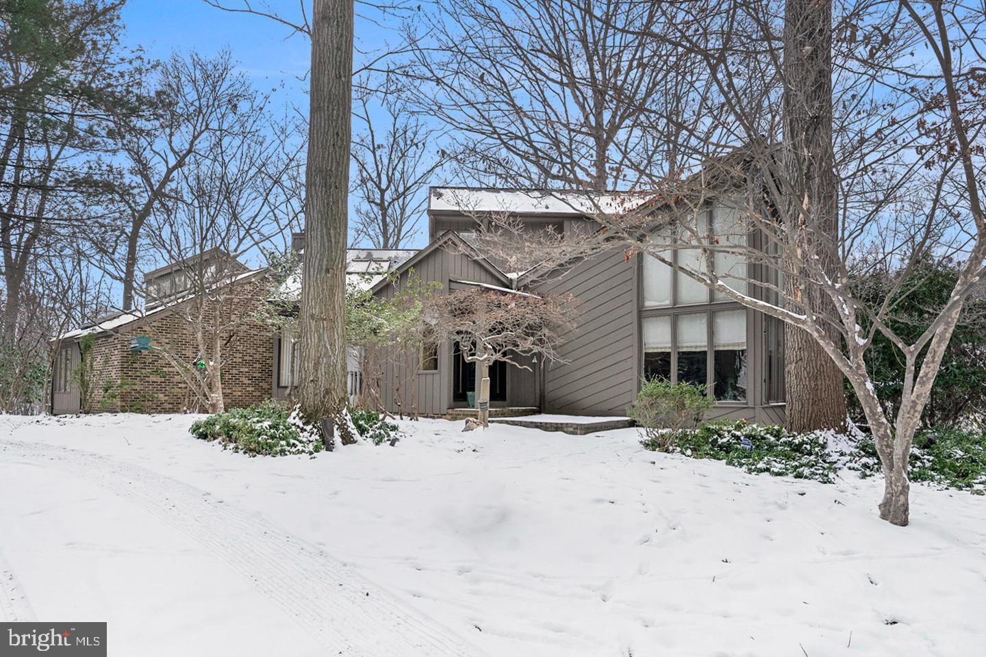a tall building with trees in front of it