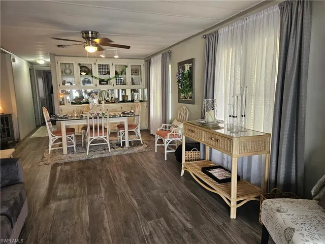 a room with lots of furniture and a large window