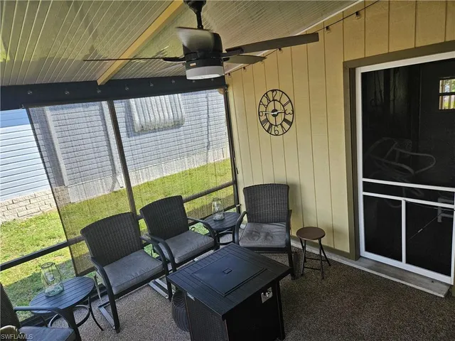 a work room with furniture and a window