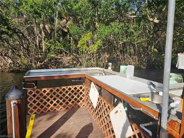 a view of balcony with wooden floor and outdoor seating