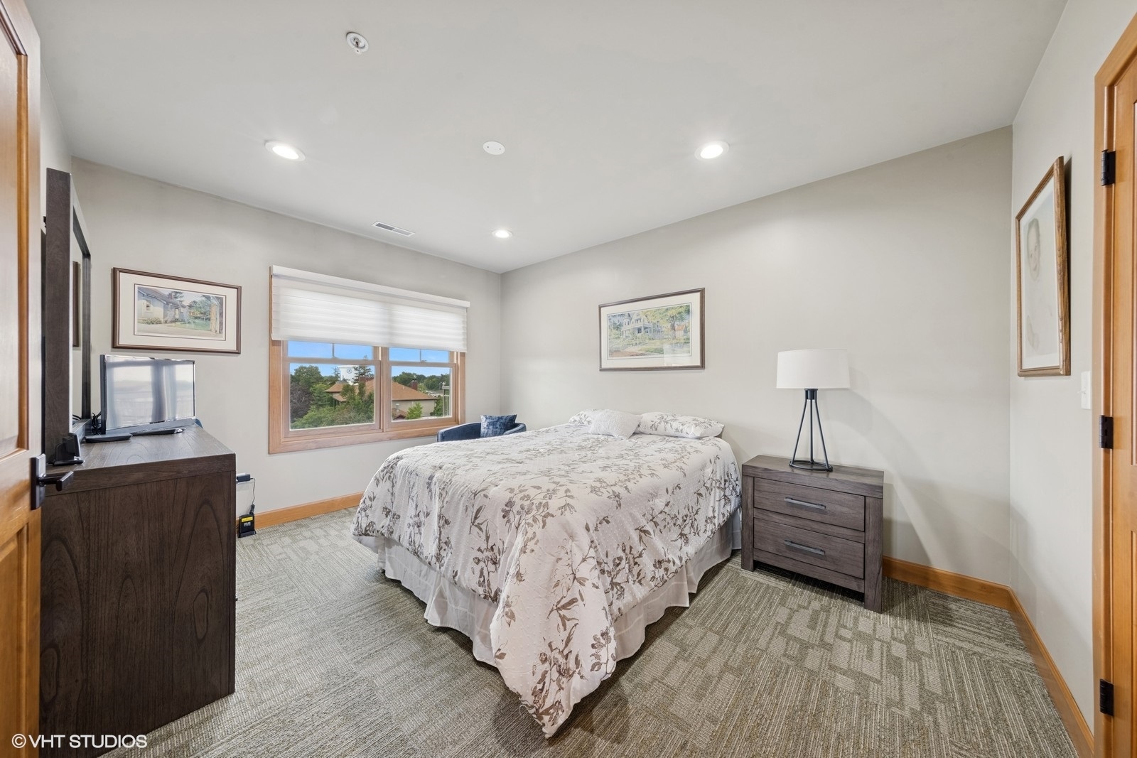 14 South Prospect Street, Unit 508 Roselle, IL 60172 - Photo 14 of 23 a bedroom with a bed and dresser with mirror