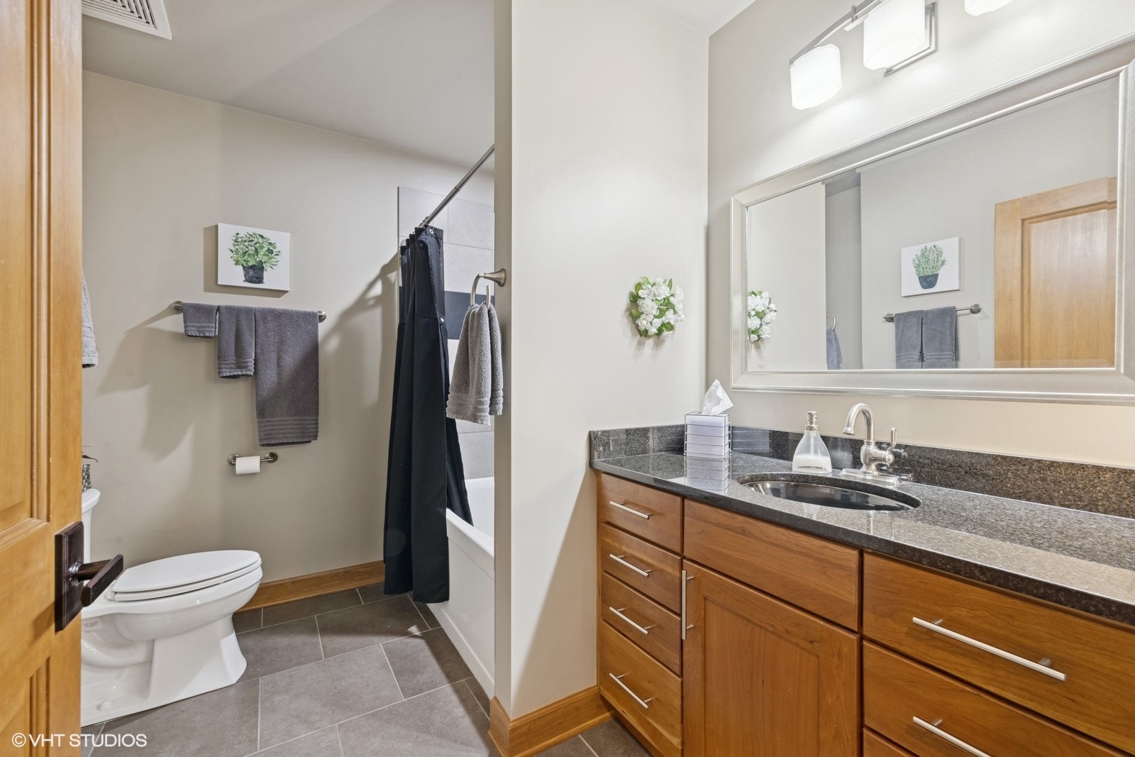14 South Prospect Street, Unit 508 Roselle, IL 60172 - Photo 15 of 23 a bathroom with a granite countertop sink toilet and shower
