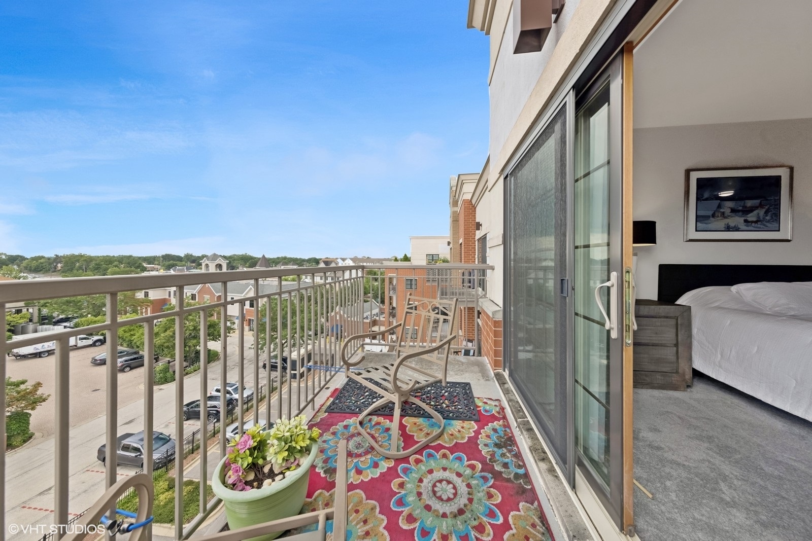 14 South Prospect Street, Unit 508 Roselle, IL 60172 - Photo 21 of 23 a view of a balcony with furniture and city view