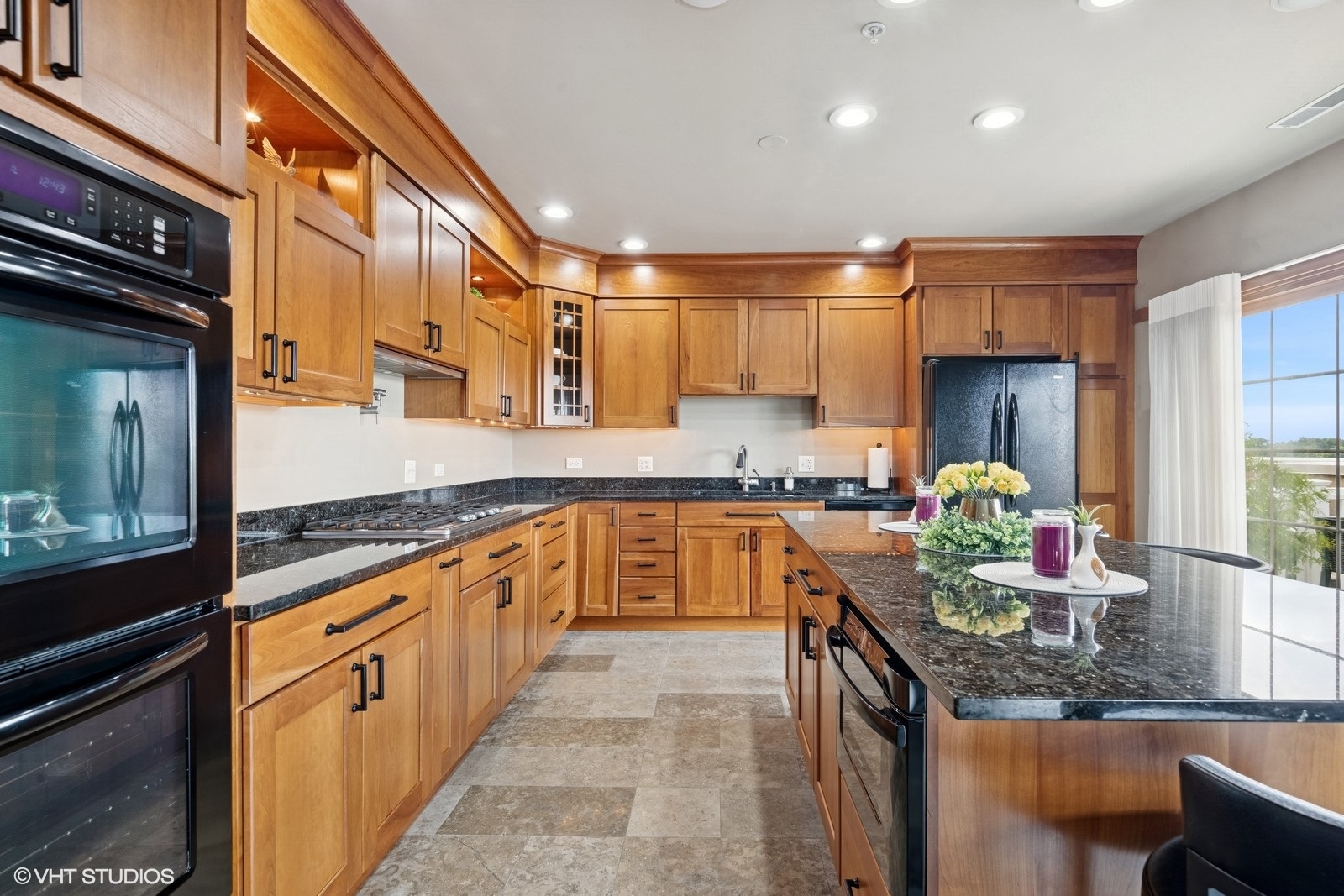 14 South Prospect Street, Unit 508 Roselle, IL 60172 - Photo 7 of 23 a kitchen with stainless steel appliances granite countertop a sink counter space cabinets and a large window