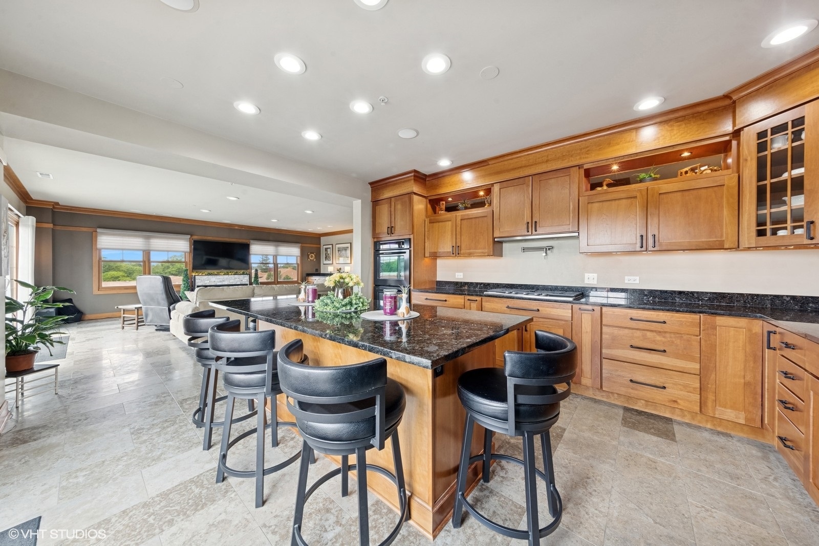 14 South Prospect Street, Unit 508 Roselle, IL 60172 - Photo 8 of 23 a kitchen with stainless steel appliances granite countertop a table chairs stove and white cabinets