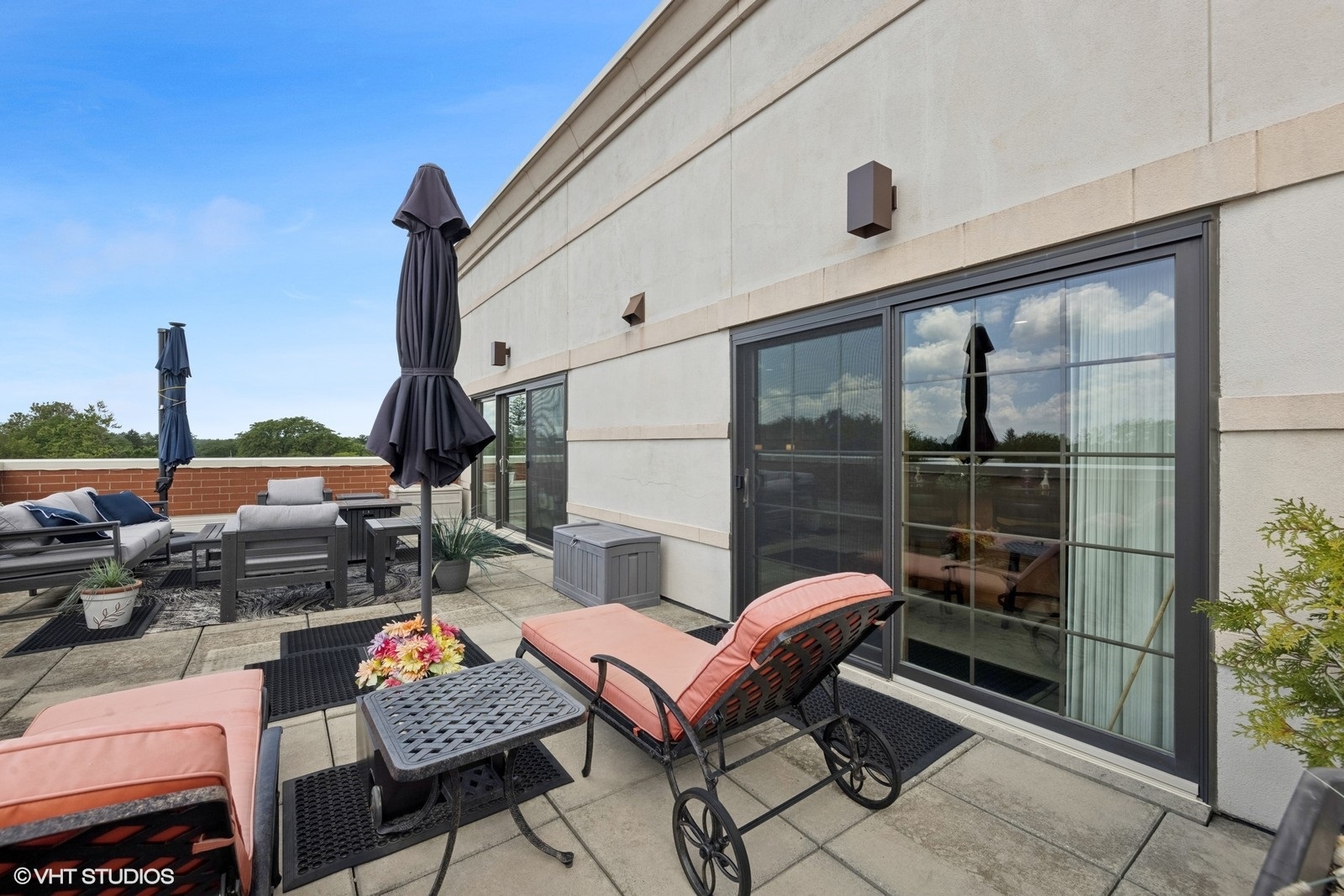 14 South Prospect Street, Unit 508 Roselle, IL 60172 - Photo 10 of 23 a view of a balcony with chairs and a potted plant