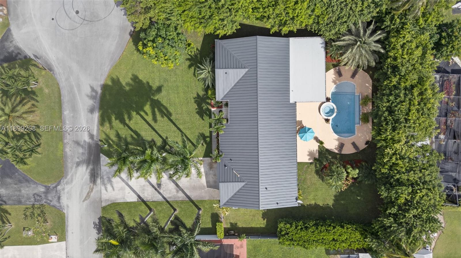 28241 Southwest 157th Court Homestead, FL 33033 - Photo 1 of 52 an aerial view of a house with a yard and garden