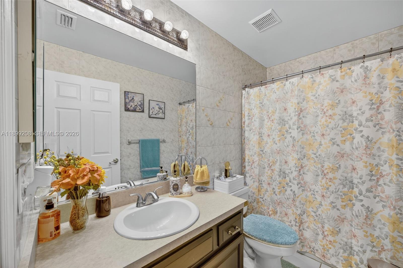 28241 Southwest 157th Court Homestead, FL 33033 - Photo 20 of 52 a bathroom with a sink toilet and mirror