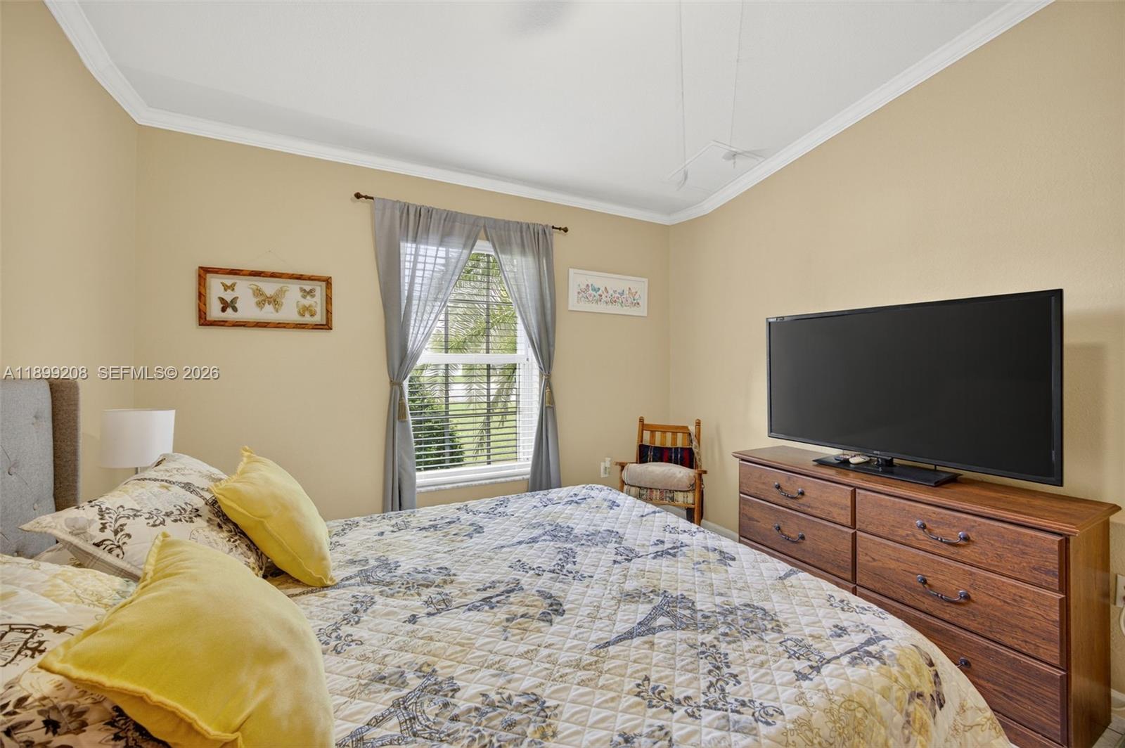 28241 Southwest 157th Court Homestead, FL 33033 - Photo 23 of 52 a bedroom with a bed and a flat screen tv on dresser