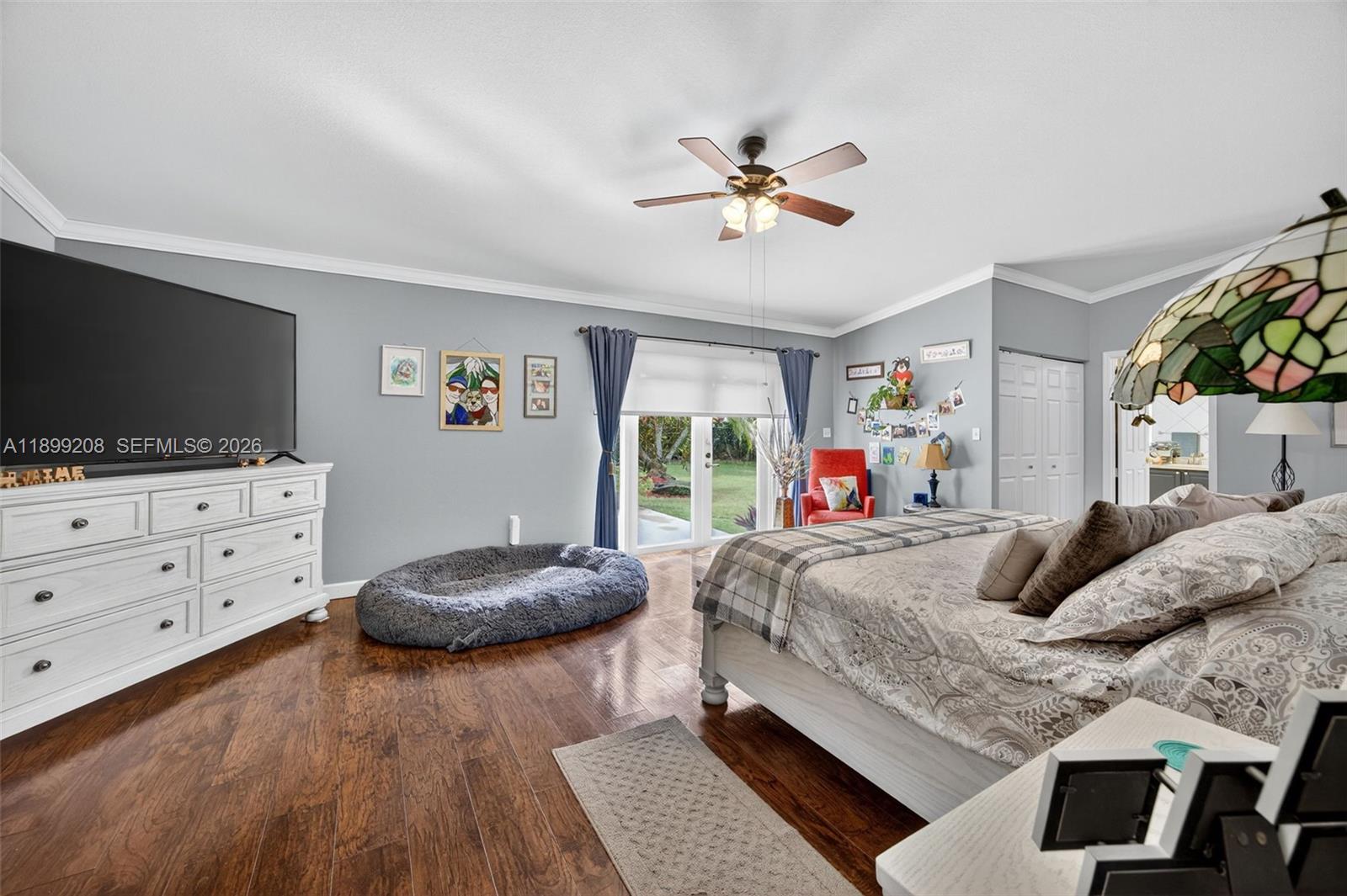 28241 Southwest 157th Court Homestead, FL 33033 - Photo 25 of 52 a bedroom with a bed and flat screen tv