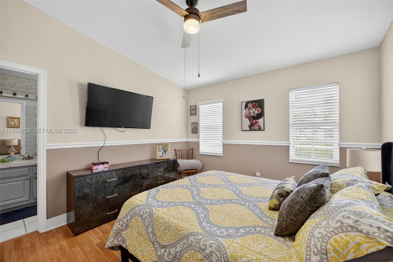 28241 Southwest 157th Court Homestead, FL 33033 - Photo 33 of 52 a bedroom with a bed and a flat screen tv