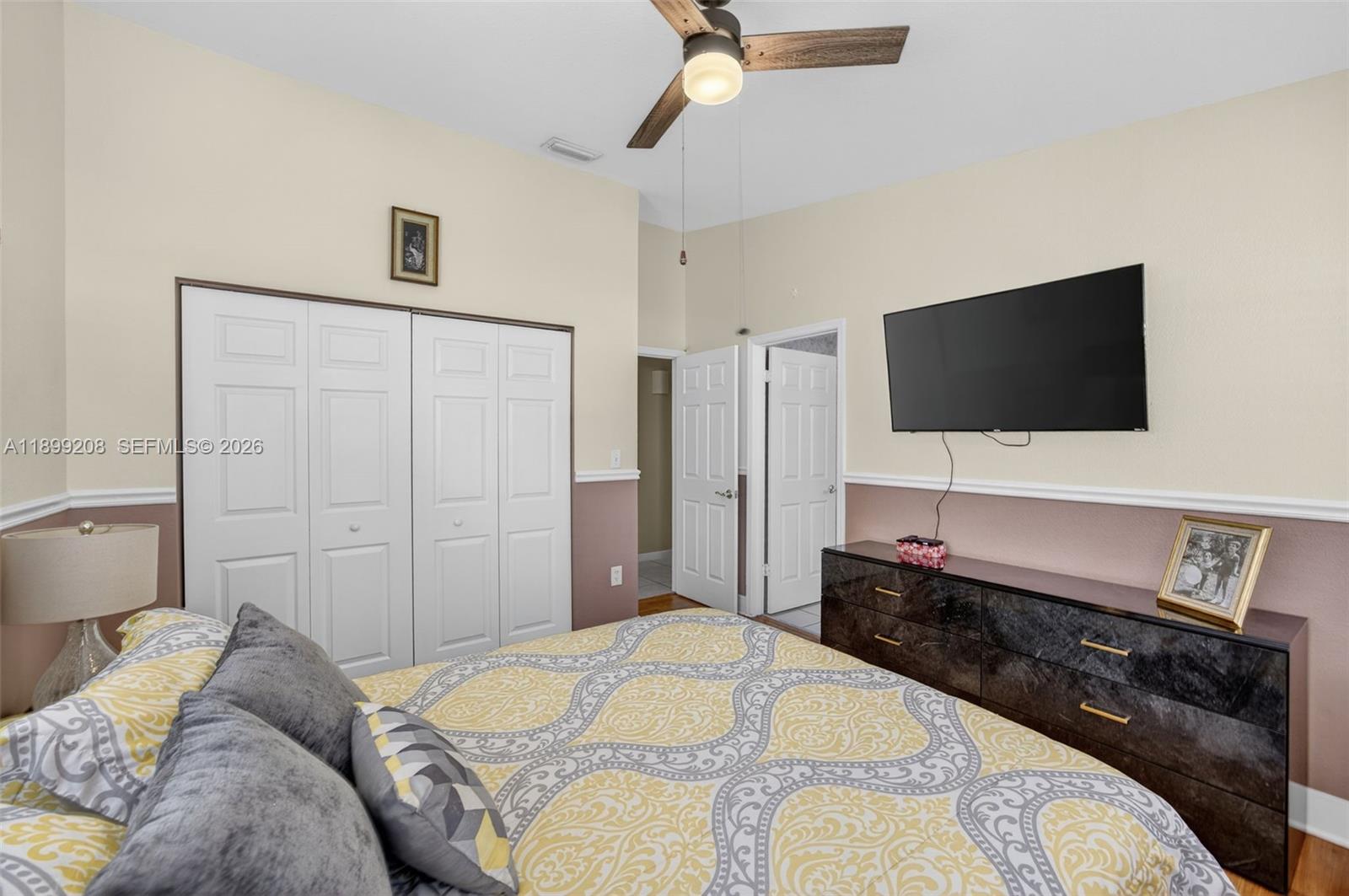 28241 Southwest 157th Court Homestead, FL 33033 - Photo 34 of 52 a bedroom with a bed and a flat screen television