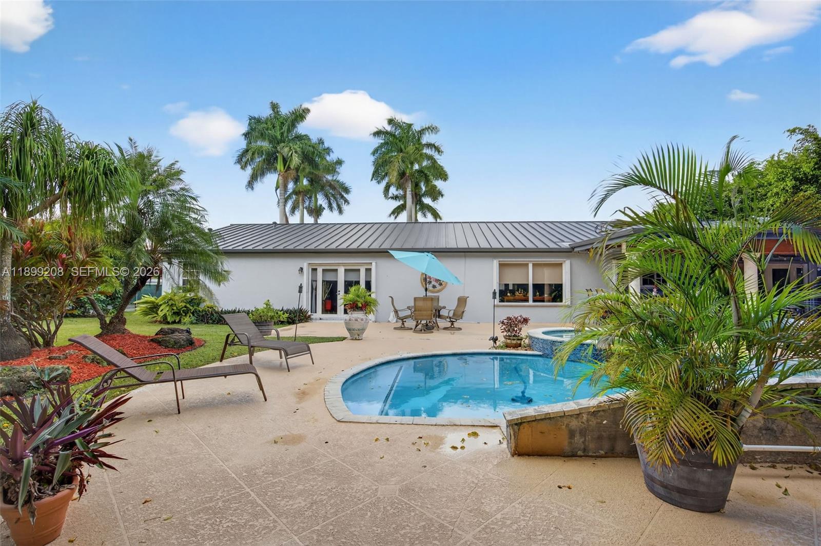 28241 Southwest 157th Court Homestead, FL 33033 - Photo 37 of 52 a view of a house with backyard and sitting area