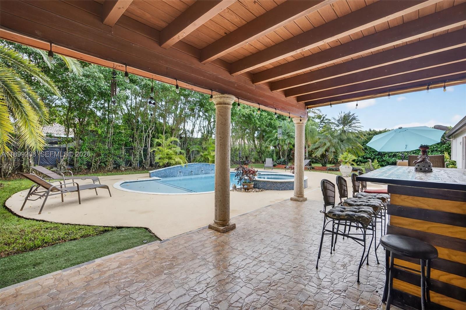 28241 Southwest 157th Court Homestead, FL 33033 - Photo 40 of 52 a view of a porch with chairs and backyard