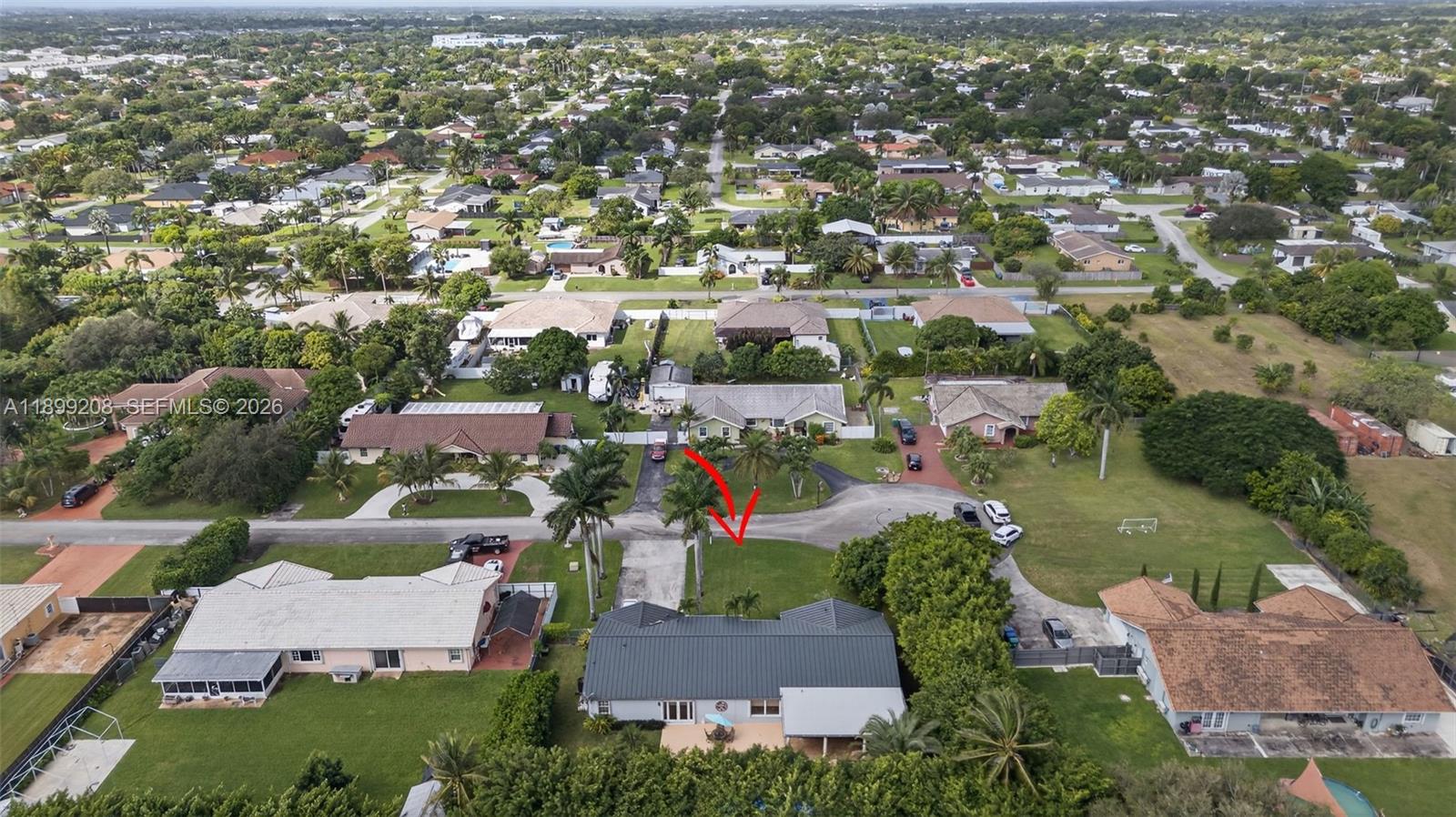 28241 Southwest 157th Court Homestead, FL 33033 - Photo 47 of 52 an aerial view of residential houses with outdoor space